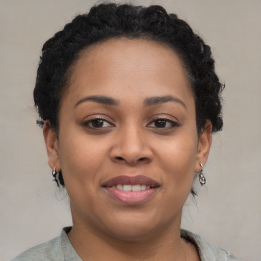 Joyful latino young-adult female with short  brown hair and brown eyes