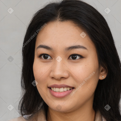 Joyful asian young-adult female with long  brown hair and brown eyes