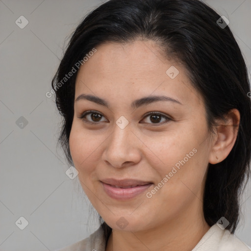 Joyful latino young-adult female with medium  brown hair and brown eyes