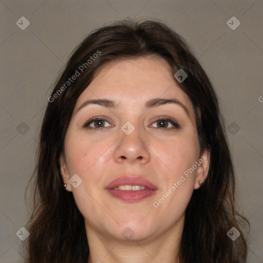 Joyful white adult female with long  brown hair and brown eyes