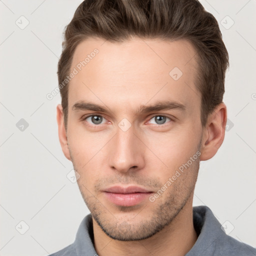 Neutral white young-adult male with short  brown hair and grey eyes