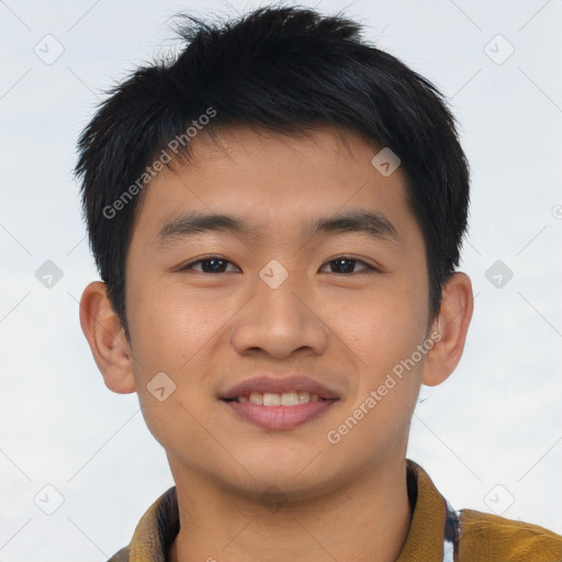 Joyful asian young-adult male with short  brown hair and brown eyes