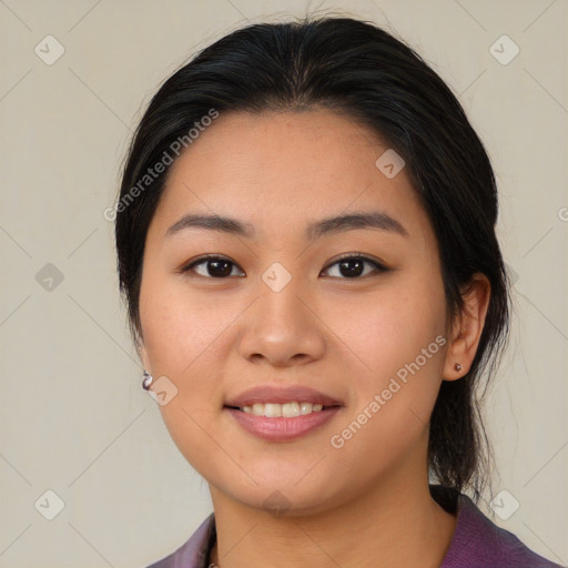 Joyful asian young-adult female with medium  brown hair and brown eyes