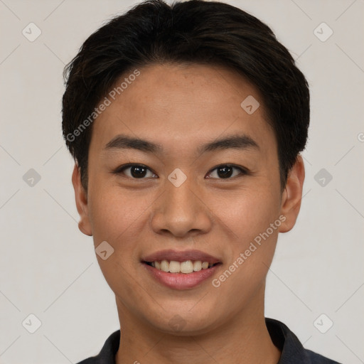 Joyful asian young-adult male with short  black hair and brown eyes