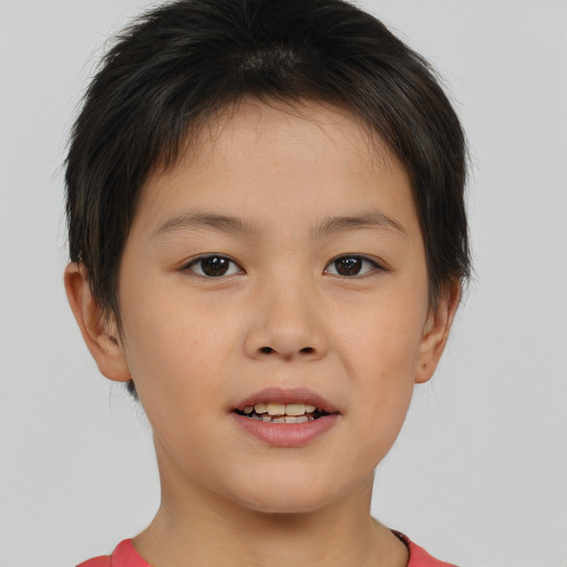 Joyful white child female with short  brown hair and brown eyes