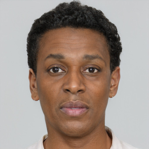 Neutral black adult female with short  black hair and brown eyes