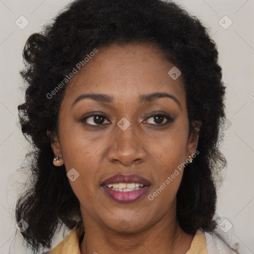 Joyful black adult female with medium  brown hair and brown eyes