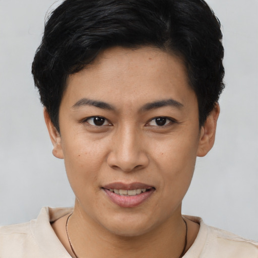 Joyful latino young-adult female with short  brown hair and brown eyes