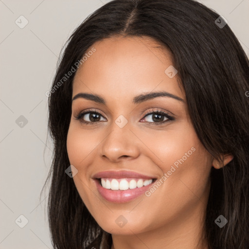 Joyful white young-adult female with long  brown hair and brown eyes