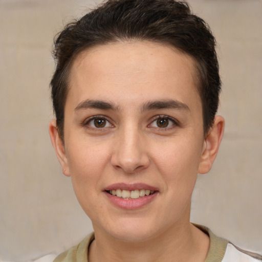 Joyful white young-adult female with short  brown hair and brown eyes