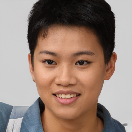 Joyful asian young-adult female with short  brown hair and brown eyes