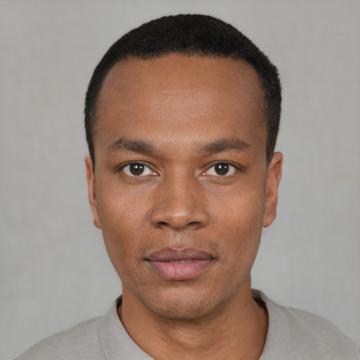 Neutral black young-adult male with short  black hair and brown eyes