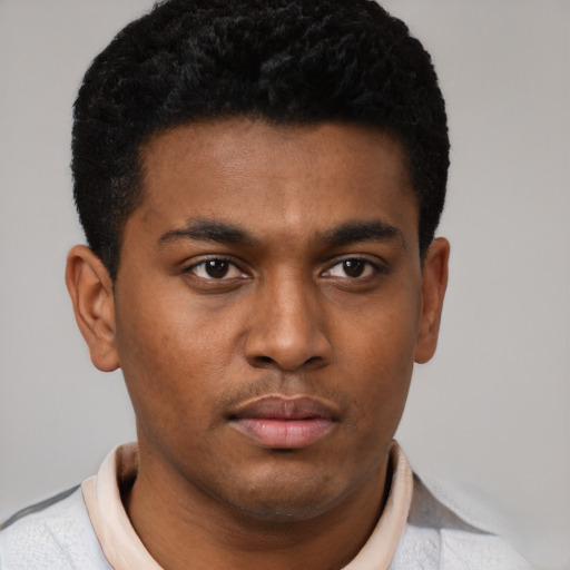 Neutral black young-adult male with short  brown hair and brown eyes