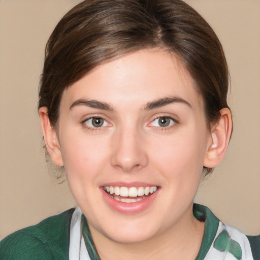 Joyful white young-adult female with medium  brown hair and green eyes