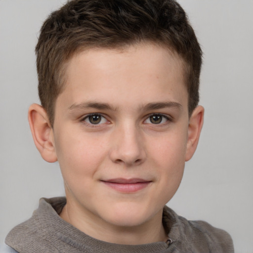 Joyful white child male with short  brown hair and grey eyes