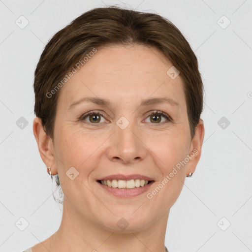 Joyful white adult female with short  brown hair and grey eyes