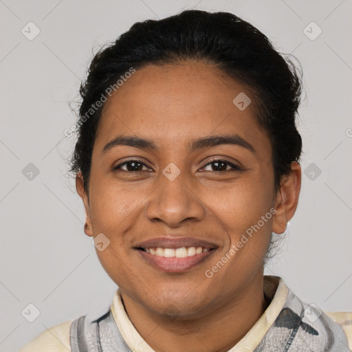 Joyful latino young-adult female with short  black hair and brown eyes