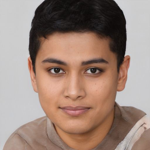 Joyful asian young-adult male with short  brown hair and brown eyes