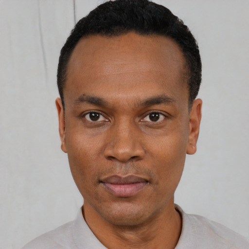 Neutral black young-adult male with short  black hair and brown eyes