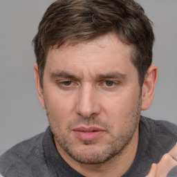 Neutral white adult male with short  brown hair and brown eyes