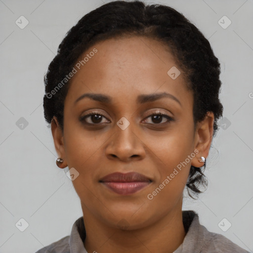 Joyful black young-adult female with short  black hair and brown eyes