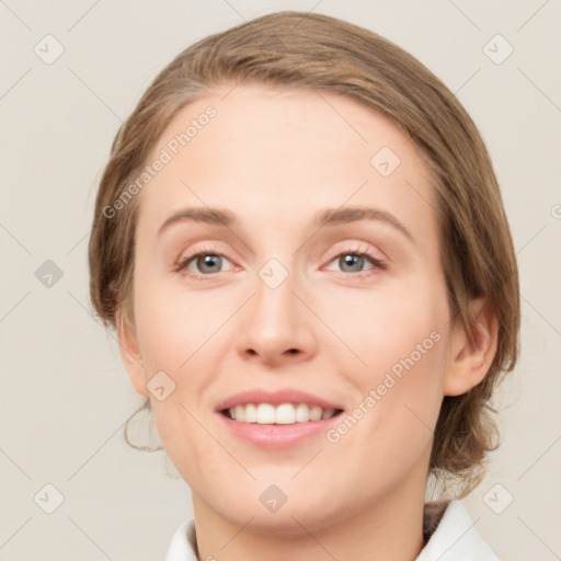 Joyful white young-adult female with medium  brown hair and green eyes