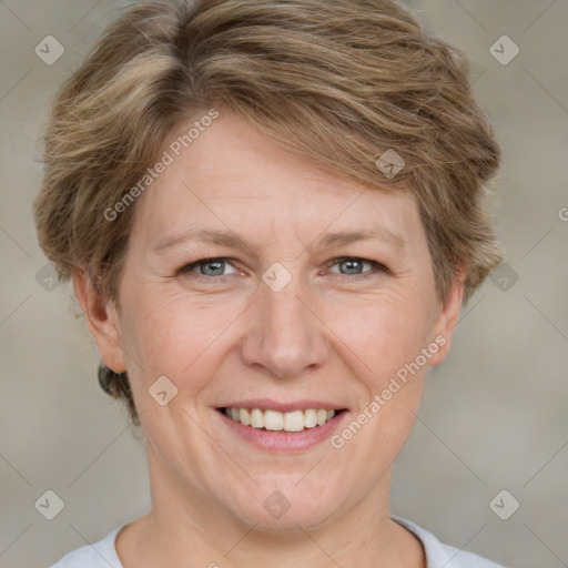 Joyful white adult female with short  brown hair and grey eyes