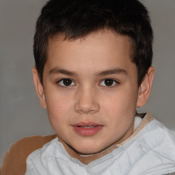 Joyful white child male with short  brown hair and brown eyes