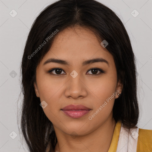 Joyful latino young-adult female with long  brown hair and brown eyes