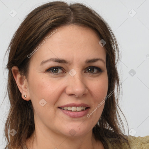 Joyful white adult female with medium  brown hair and brown eyes