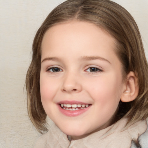 Joyful white child female with medium  brown hair and brown eyes