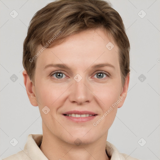 Joyful white young-adult female with short  brown hair and grey eyes