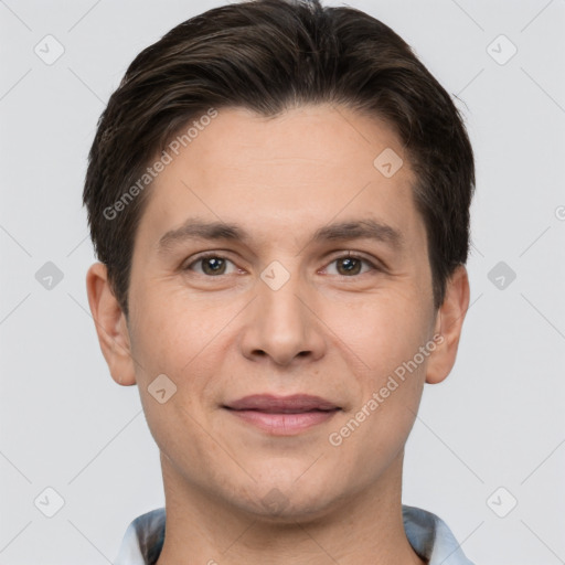 Joyful white adult male with short  brown hair and brown eyes