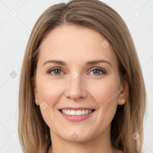 Joyful white young-adult female with long  brown hair and grey eyes