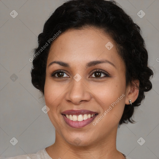 Joyful latino young-adult female with short  brown hair and brown eyes