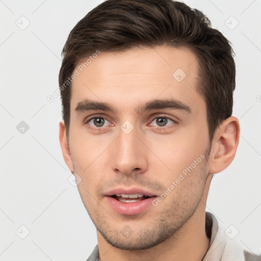 Neutral white young-adult male with short  brown hair and brown eyes