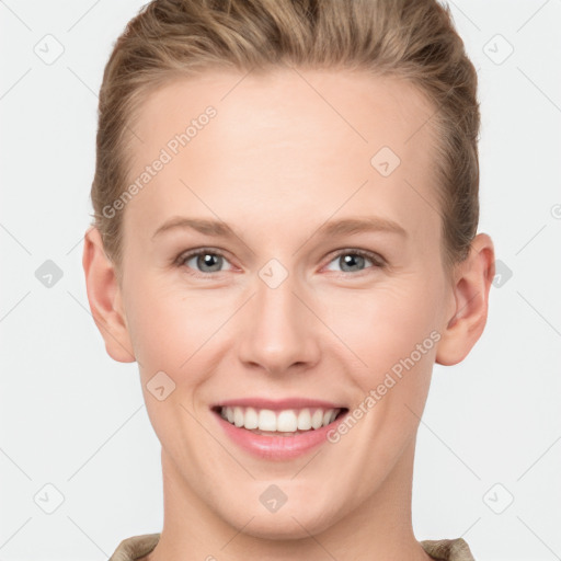 Joyful white young-adult female with short  brown hair and grey eyes