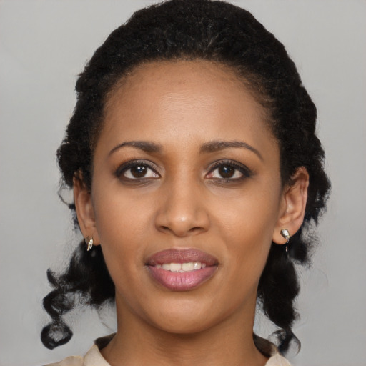 Joyful black young-adult female with medium  black hair and brown eyes