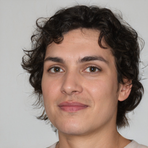 Joyful white young-adult male with medium  brown hair and brown eyes