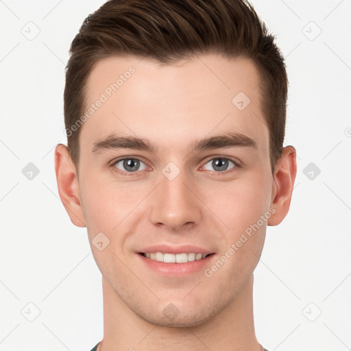 Joyful white young-adult male with short  brown hair and grey eyes