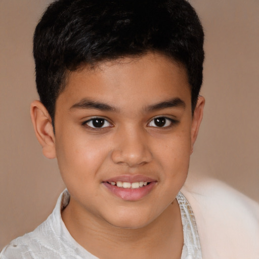 Joyful latino child male with short  brown hair and brown eyes