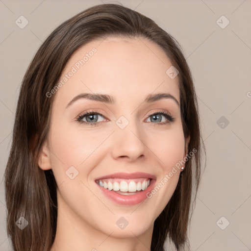 Joyful white young-adult female with medium  brown hair and grey eyes