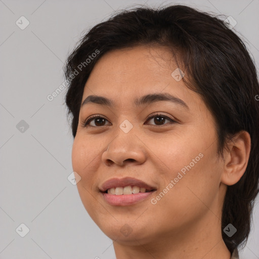 Joyful white young-adult female with medium  brown hair and brown eyes