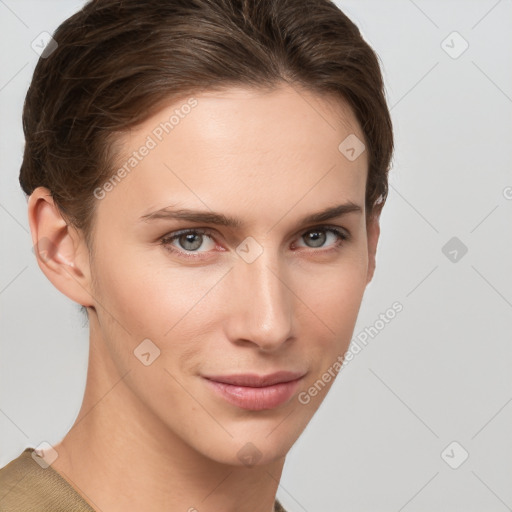 Joyful white young-adult female with short  brown hair and grey eyes