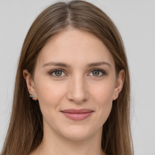 Joyful white young-adult female with long  brown hair and grey eyes