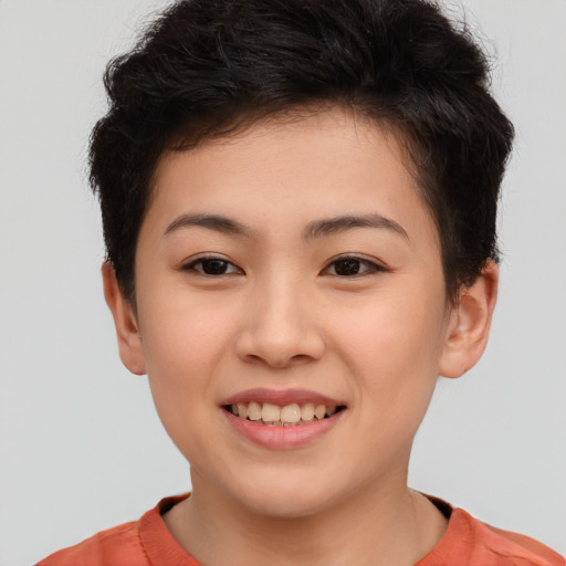 Joyful asian child female with short  brown hair and brown eyes