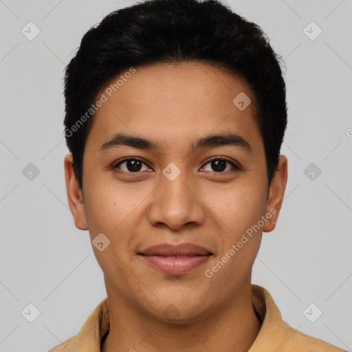 Joyful latino young-adult male with short  black hair and brown eyes