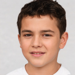 Joyful white child male with short  brown hair and brown eyes