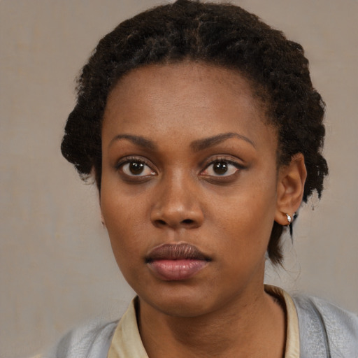 Neutral black young-adult female with medium  black hair and brown eyes