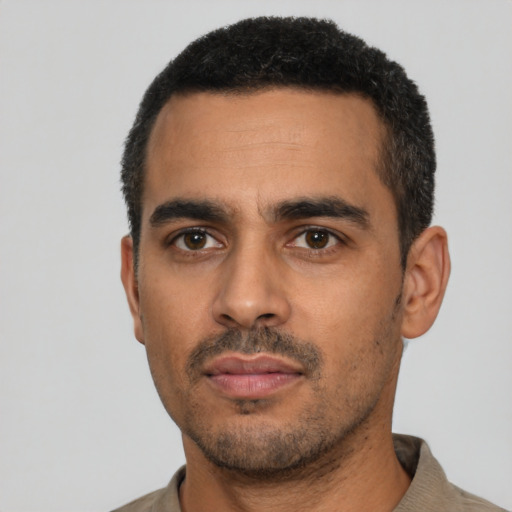 Neutral latino young-adult male with short  black hair and brown eyes